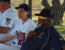 Pitching great and Pro Staff member, Luis Tiant looks on with Annie Breitenbucher during 2012 camp action.