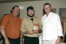 Chris Trela receives his Gold Glove in the under 50 category from Juan Berenguer and Bill Campbell.